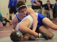 Chambersburg's Spencer Runshaw, top, is shown defeating Waynesboro's Laken Rouzer for a sectional title last year. This year, Runshaw is only a No. 6 seed in a tough weight class.