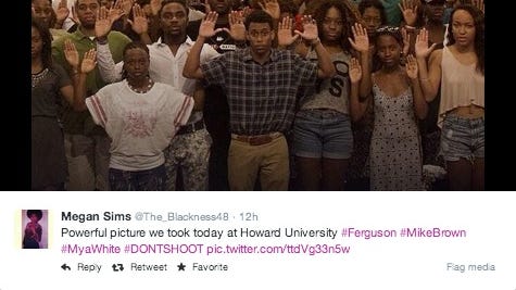A photo of people with their hands up at Howard University.