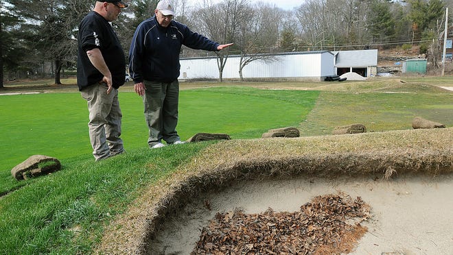 Greens Chairman Ken Mooradian, right, goes over the area of a bunker that will be altered with Lanzetta Excavating's John Rondeau at Hopedale Country Club in March 2016. The club is seeking relief from its rent after being shut down for 46 days due to the coronavirus.