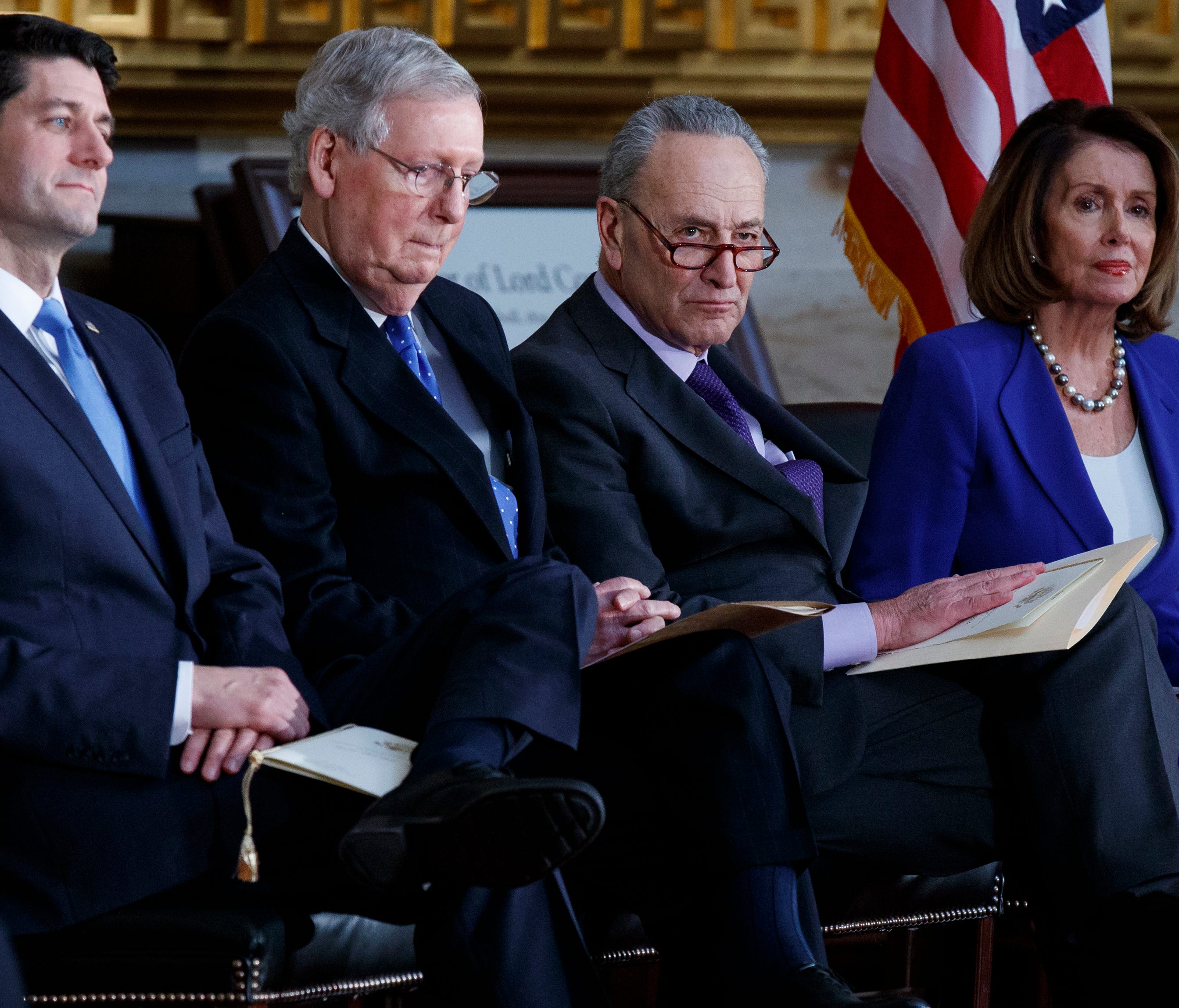 Speaker of the House Rep. Paul Ryan, R-Wis., Senate Majority Leader Mitch McConnell, R-Ky., Senate Minority Leader Chuck Schumer, D-N.Y., and House Minority Leader Rep. Nancy Pelosi, D-Calif., listen as President Donald Trump speaks during a Congress