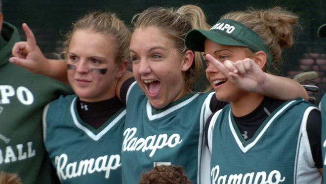 From 2006: Ramapo pitcher Brittany Baiunco (7)(center) celebrating Ramapo's 3 - 0 win over Tenafly Sunday in the Bergen County Girls Softball Tournament Final at Northern Valley Old Tappan High School in Old Tappan.  Sam Depken (4) is left and Amy Piccinich (11) is right.