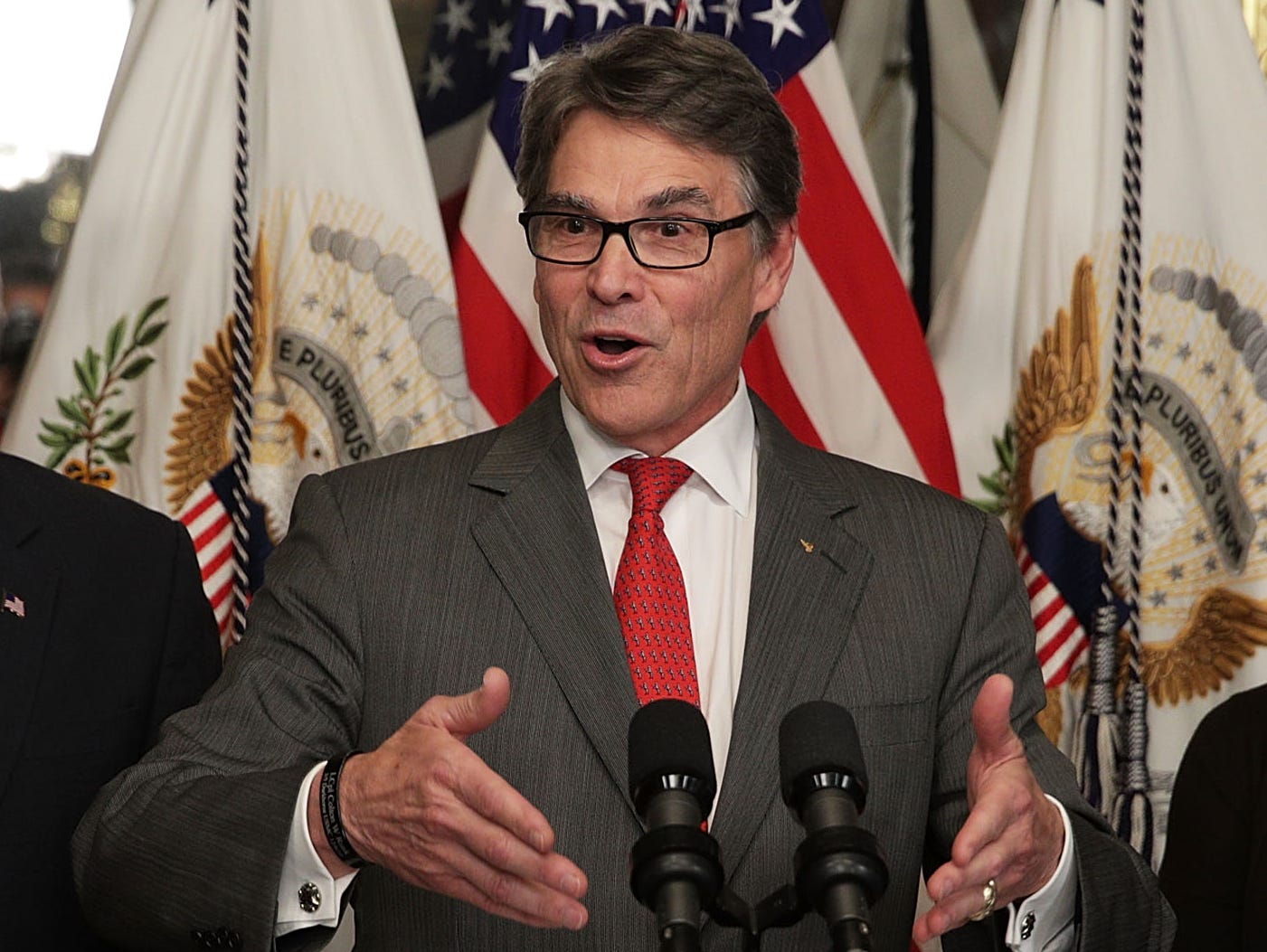 Rick Perry speaks during his swearing-in ceremony, officiated by Vice President Pence, as Perry's wife, Anita, looks on at Eisenhower Executive Office Building on March 2, 2017.