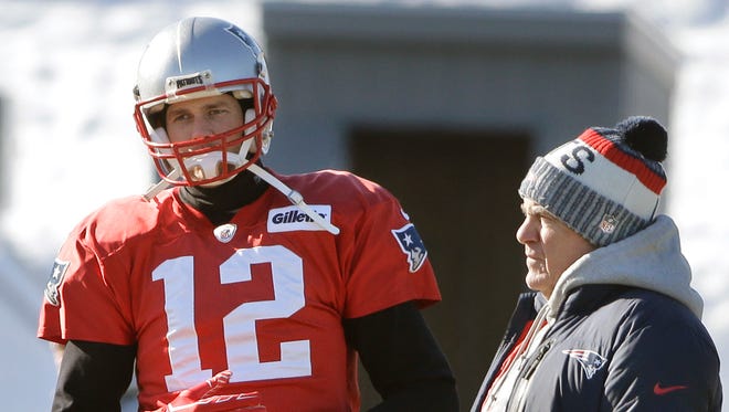 New England Patriots quarterback Tom Brady, left, stands with head coach Bill Belichick, right, during an NFL football practice, Thursday, Jan. 18, 2018, in Foxborough, Mass.