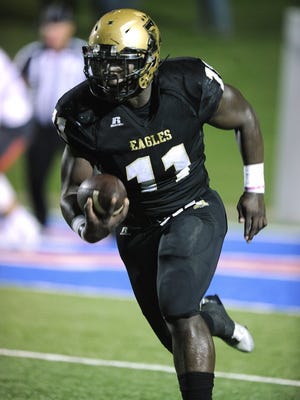 Abilene High linebacker Ronnell Wilson carries the ball during an Eagles' game in 2016.
