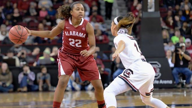 Alabama's Karyla Middlebrook brings the ball up the court while defended by South Carolina's Bianca Cuevas during the first half of an NCAA college basketball game Thursday, Jan. 29, 2015, in Columbia, S.C.