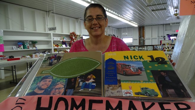 Bambi Jones sits with the family scrapbook she made and a sash her cousins made to honor her achievement as the 2017 Homemaker of the Year. She entered 148 projects into the Ross County Fair with the scrapbook being her favorite.