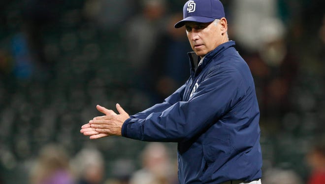 San Diego Padres manager Bud Black (20) applauds as his players walk back to the dugout after the final out of a 4-2 victory against the Seattle Mariners at Safeco Field on May 13, 2015. Black has been hired as the new manager of the Colorado Rockies.