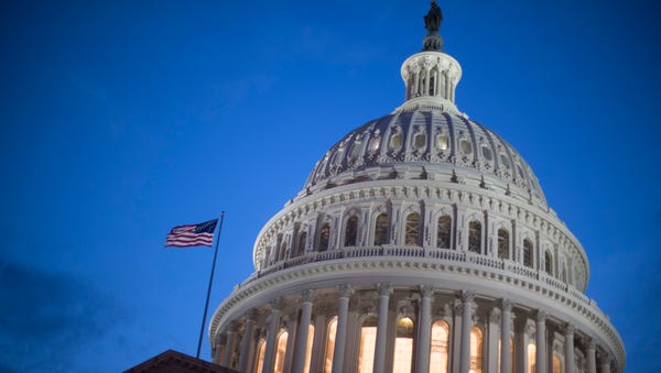 The U.S. Capitol Building is seen at sunset on...