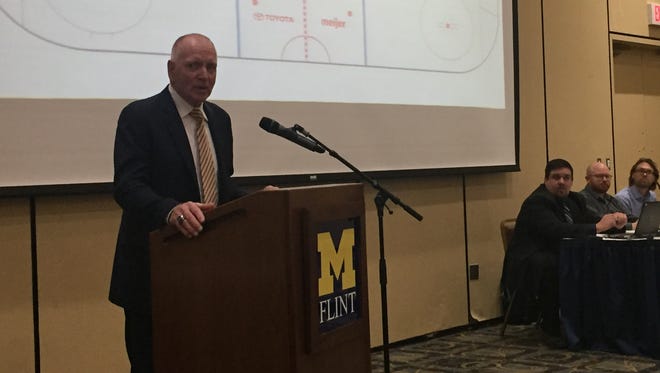 Retired Michigan hockey coach Red Berenson thanks the Board of Regents following their naming of the ice rink at Yost Ice Arena for him Thursday.