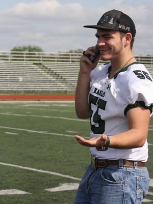 Tyland Wolfe's photograph taken by his sister Amber Henson at the Grape Creek football field for senior pictures. "That smile is real," Henson wrote in an email. "He was on the phone, trying to get two of his best friends to hurry and meet us."