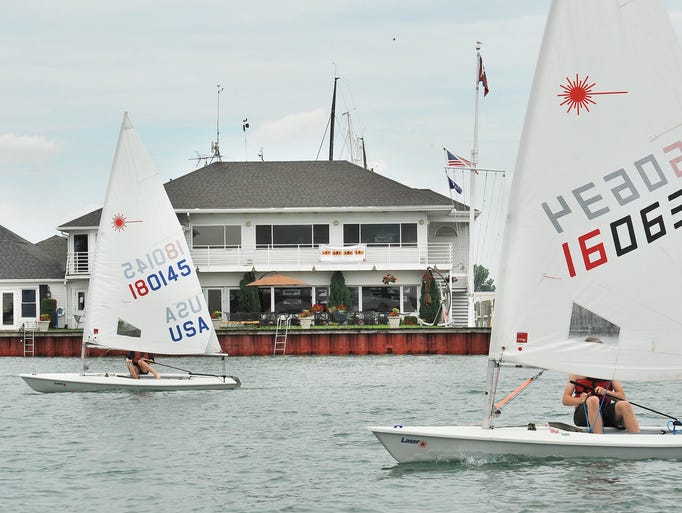 Eva Rossell, 14, and Anthony Lane, 15, sail past the