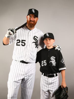 Feb 28, 2015: Chicago White Sox infielder Adam LaRoche (left) poses for a portrait with son Drake LaRoche during photo day at Camelback Ranch.