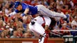 April 25: Blue Jays' Chris Coghlan leaps over Cardinals
