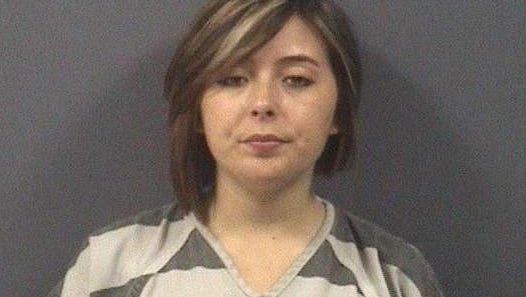 Hayley Turner, 18, seen here in her booking photo, said she was abducted by a man with a gun last month.