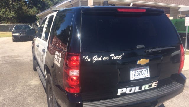 Youngsville police put "In God We Trust" decals on their vehicles.