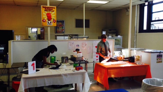 Lynn Allen from General Mills and Brian Quilty, Health Corps coordinator at Millville’s Memorial High School, prepare smoothies for a tasting held at the school on Oct. 30.