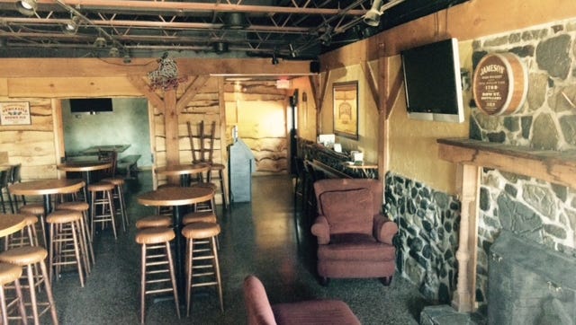 Patton Public House, featuring family dining and two bars, will open in three to six weeks in the former Barbecue Inn location. This is a bar area.
