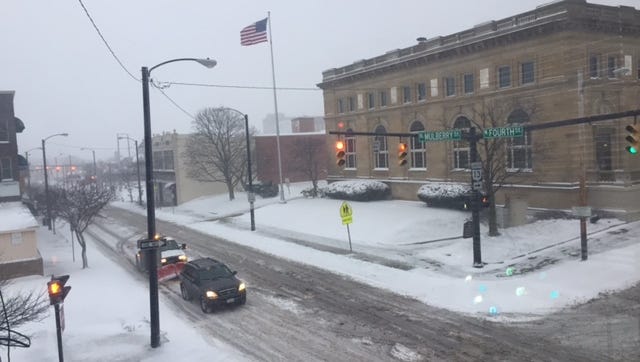Downtown  Mansfield streets are slippery Tuesday morning slowing motorists on their way to work.