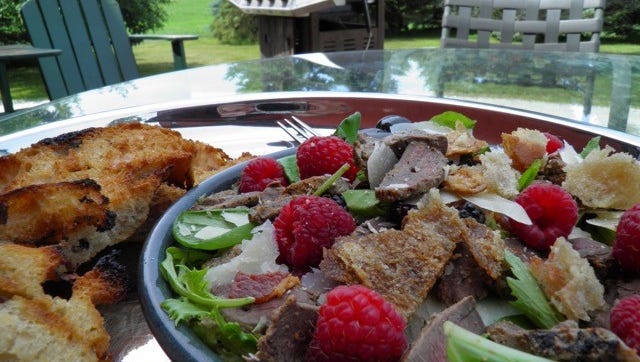 Dawn Morin-Boucher used marinated, grilled pigeon in this salad with local raspberries and goat cheese. She said the pigeon is similar to duck meat.