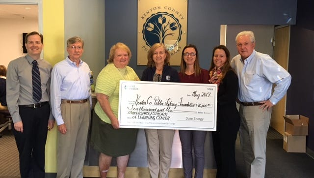 Duke Energy presented the Kenton County Public Library with $10,000 for its makerspace now under construction. Pictured far left Executive Director, Dave Schroeder, Board of Trustees (left to right): Douglas Stephens, Louise Canter, Susan Mospens, Casey Ruschman (Duke Energy), Julie Roesel Belton, Dan Humpert.