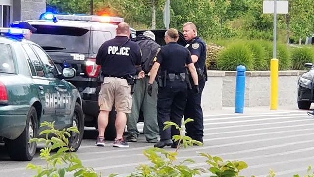 Port Orchard Police officers arrested a man who allegedly threatened employees in the liquor aisle of Port Orchard Walmart on June 14, 2018.