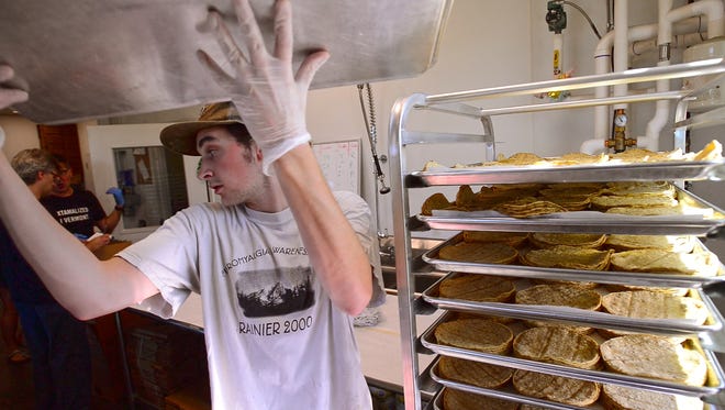 Vermont’s business sector consists of nearly 16,000 firms who employ about 265,000 workers. Those firms range in size from tiny operations like a food truck to large businesses such as GlobalFoundries and Ben and Jerry’s. Seen here is a worker at the Vermont Tortilla Company, a small business in Shelburne.