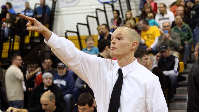 ason McElwain acknowledges the fans during a ceremony held at Greece Athena High School to retire his basketball jersey number. 
  
Jason McElwain acknowledges the fans during a ceremony to retire his number.