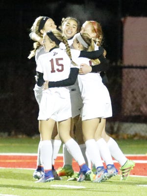 Elmira players celebrate a goal from Kendra Oldroyd against Horseheads on Friday in the Section 4 Class AA girls soccer championship game at Waverly Memorial Stadium.