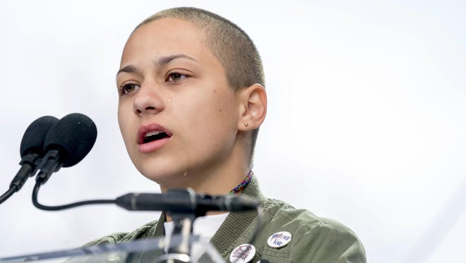 In this March 24, 2018 file photo, Emma Gonzalez, a survivor of the mass shooting at Marjory Stoneman Douglas High School in Parkland, Fla., closes her eyes and cries as she stands silently at the podium for the amount of time it took the Parkland shooter to go on his killing spree during the "March for Our Lives" rally in support of gun control in Washington. A doctored photo online appeared to show Gonzalez tearing up the U.S. Constitution. , Saturday, March 24, 2018.