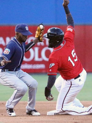 San Diego Padres infielder Alexei Ramirez, left, caught a throw to second base just in time to tag Yelson Asencio, 15, of the El Paso Chihuahuas out during their exhibition game Thursday night at Southwest University Park.