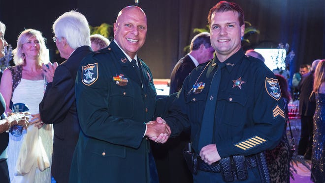 Lee County Sheriff Mike Scott and Officer of the Year Sgt. James Matthew Chitwood