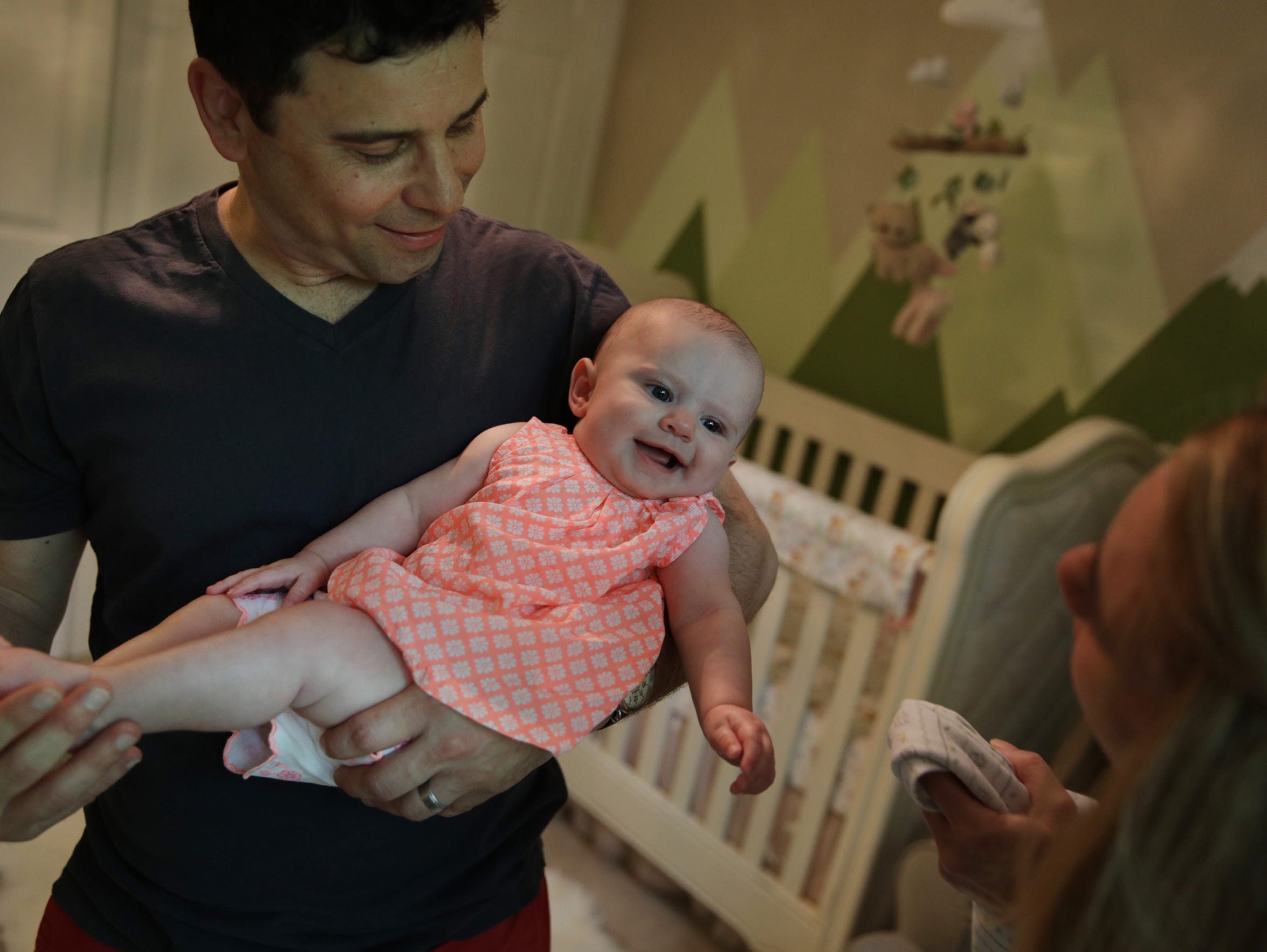 Frank D'Angelo holds his five-month-old daughter Briar