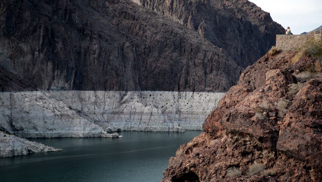 As Lake Mead has declined, a white "bathtub ring" has been left on the rocky banks by minerals and the receding water. This photo was taken in 2014.