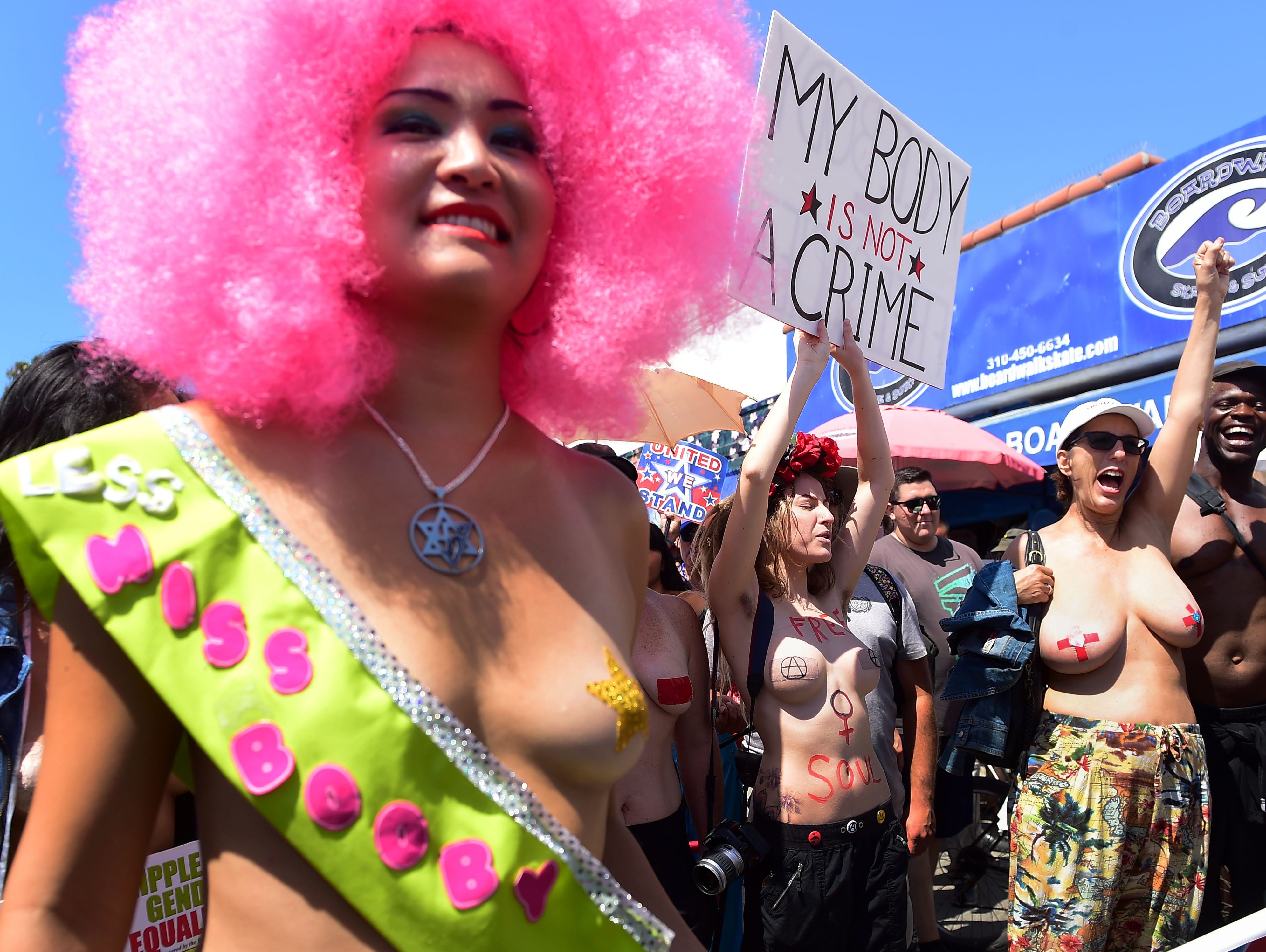 Advocates for topless equality gather with fellow topless equality advocates for the annual Go Topless march on August 26, 2016 in Venice, Calif.
