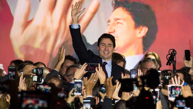Canadian Liberal Party leader Justin Trudeau arrives greets supporter in Montreal on Oct. 20, 2015, after winning the general election.