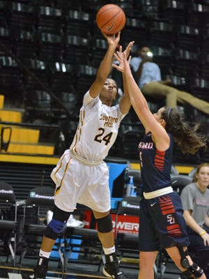Southern Miss guard Brittny Norris takes a shot Saturday during the Lady Eagles' game against Samford. Southern Miss won, 56-48, to win the Lady Eagle Thanksgiving Tournament.