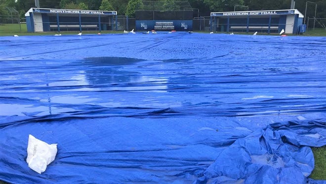 Northern Burlington softball coach Brian Wolverton donated a tarp to the program this spring. It paid dividends last week as the Greyhounds were able to play their first-round playoff game.
