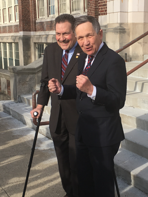 Dennis Kucinich, right, appears at a press conference