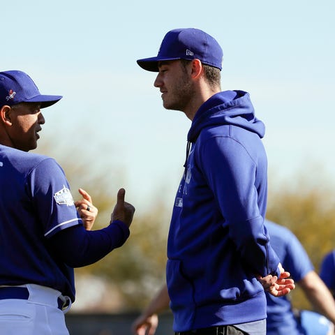 Los Angeles Dodgers manager Dave Roberts, left, ta