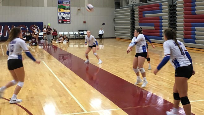 Seaman senior Sam Ingram, middle, returns a serve during Saturday's Seaman Invitational volleyball tournament. The Vikings finished second to Lansing with a 4-1 record.
