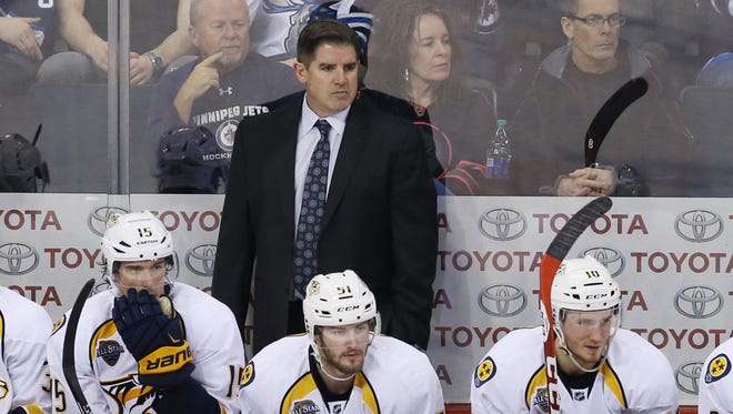 Peter Laviolette won a Stanley Cup with Carolina in 2006 and is trying to get the Nashville Predators there this year.