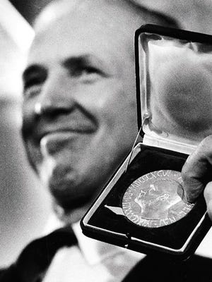 Norman Borlaug displays his Nobel Peace Prize in Cresco in December 1970.