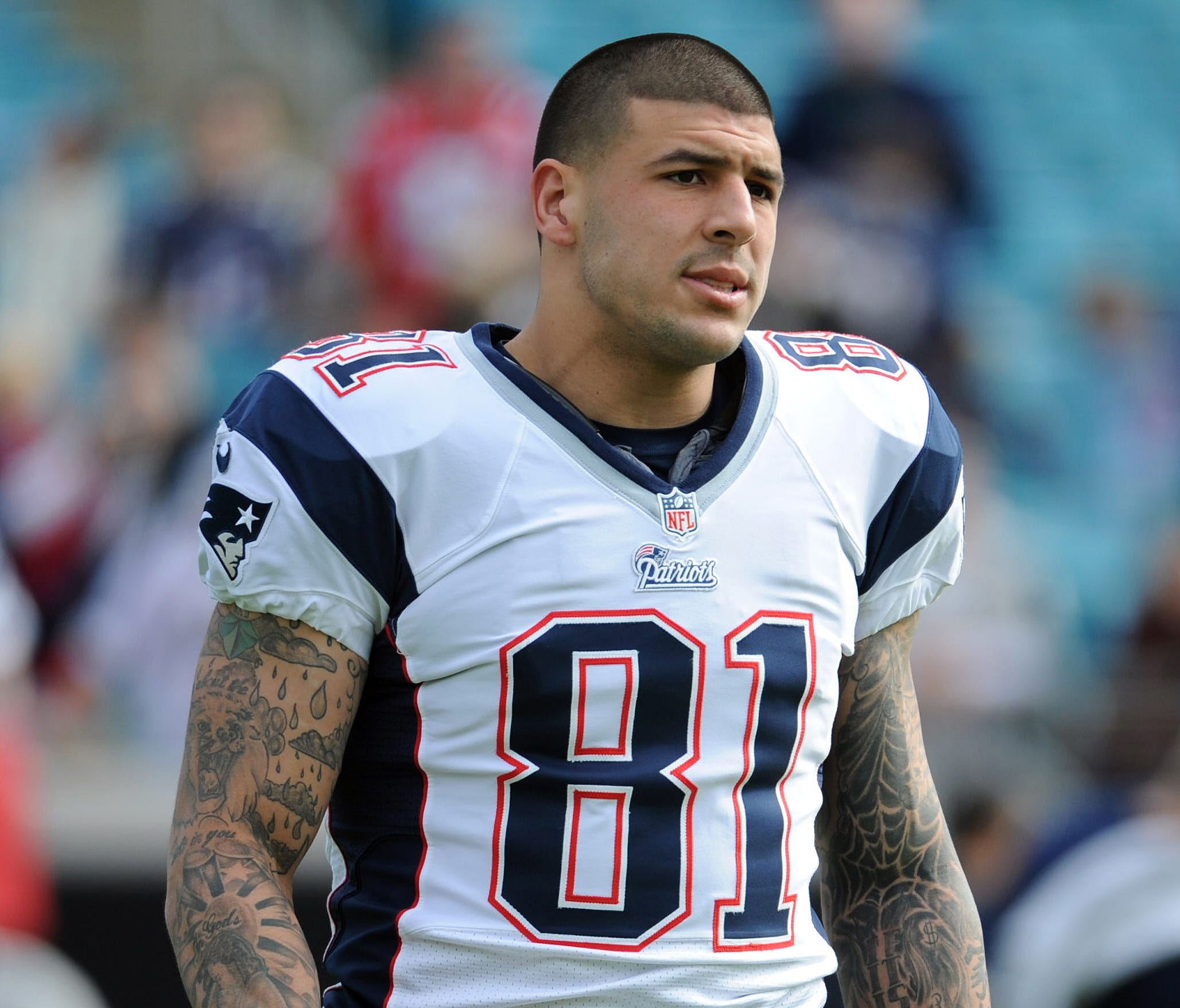 Former New England Patriots tight end Aaron Hernandez (81) warms up before the start of the game against the Jacksonville Jaguars at EverBank Field.
