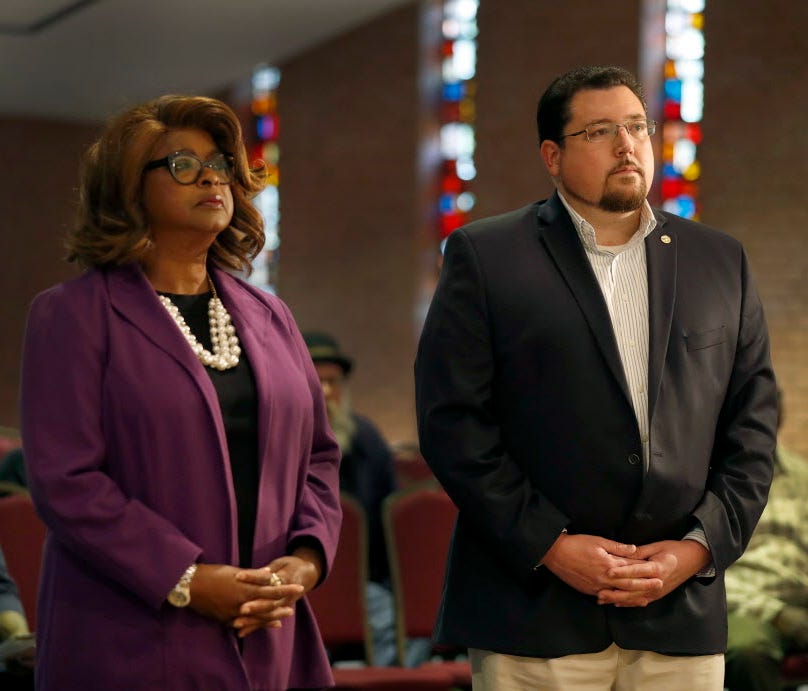 Ferguson Mayor James Knowles III, right, and councilwoman Ella Jones stand just off stage as they are introduced before a mayoral forum in Ferguson, Mo. on March 30, 2017.