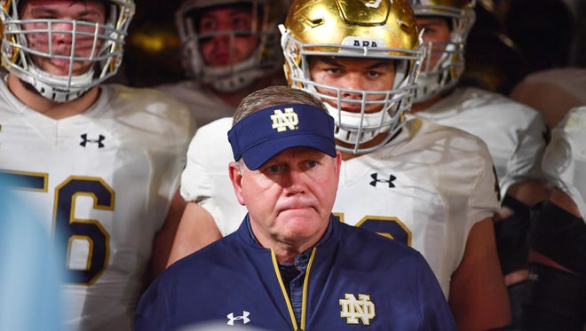 Nov 11, 2017; Miami Gardens, FL, USA; Notre Dame Fighting Irish head coach Brian Kelly and his players prepare to take the filed for the second half of the game against the Miami Hurricanes at Hard Rock Stadium. Mandatory Credit: Matt Cashore-USA TODAY Sports