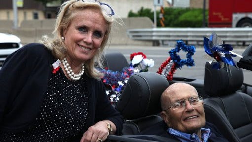 Debbie Dingell with her husband former United States Representative John Dingell during Dearborn's 91st annual Memorial Day parade on Michigan Ave. in Dearborn on Monday, May 25, 2015.