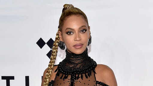 FILE - In this Oct. 15, 2016 file photo, singer Beyonce Knowles attends the Tidal X: 1015 benefit concert in New York.  Beyonce is nominated for Grammy Awards for best album, best song and record of the year.
