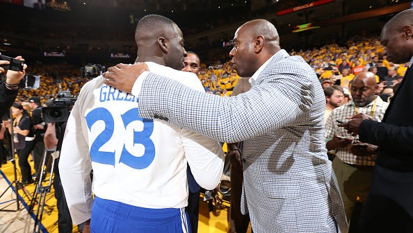 Draymond Green and Earvin “Magic” Johnson chat prior to Game 1 of the NBA Finals in Oakland, California.