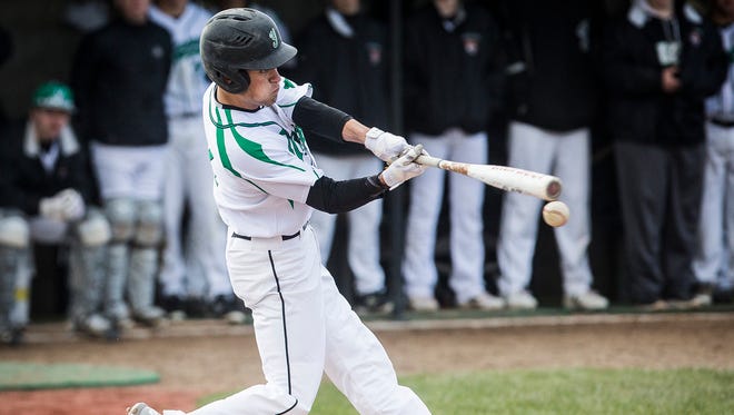 Yorktown's Luke Hill hits against Delta during a doubleheader at Yorktown High School Tuesday, April 17, 2018.