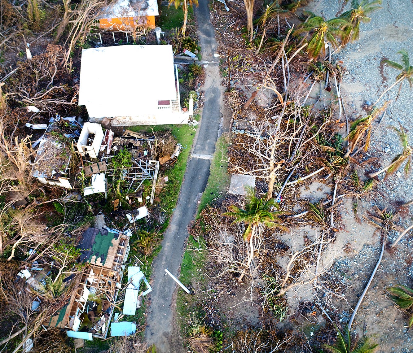 Damaged homes and downed trees are seen along the coast of Maunabo, Puerto Rico Oct. 2, 2017.